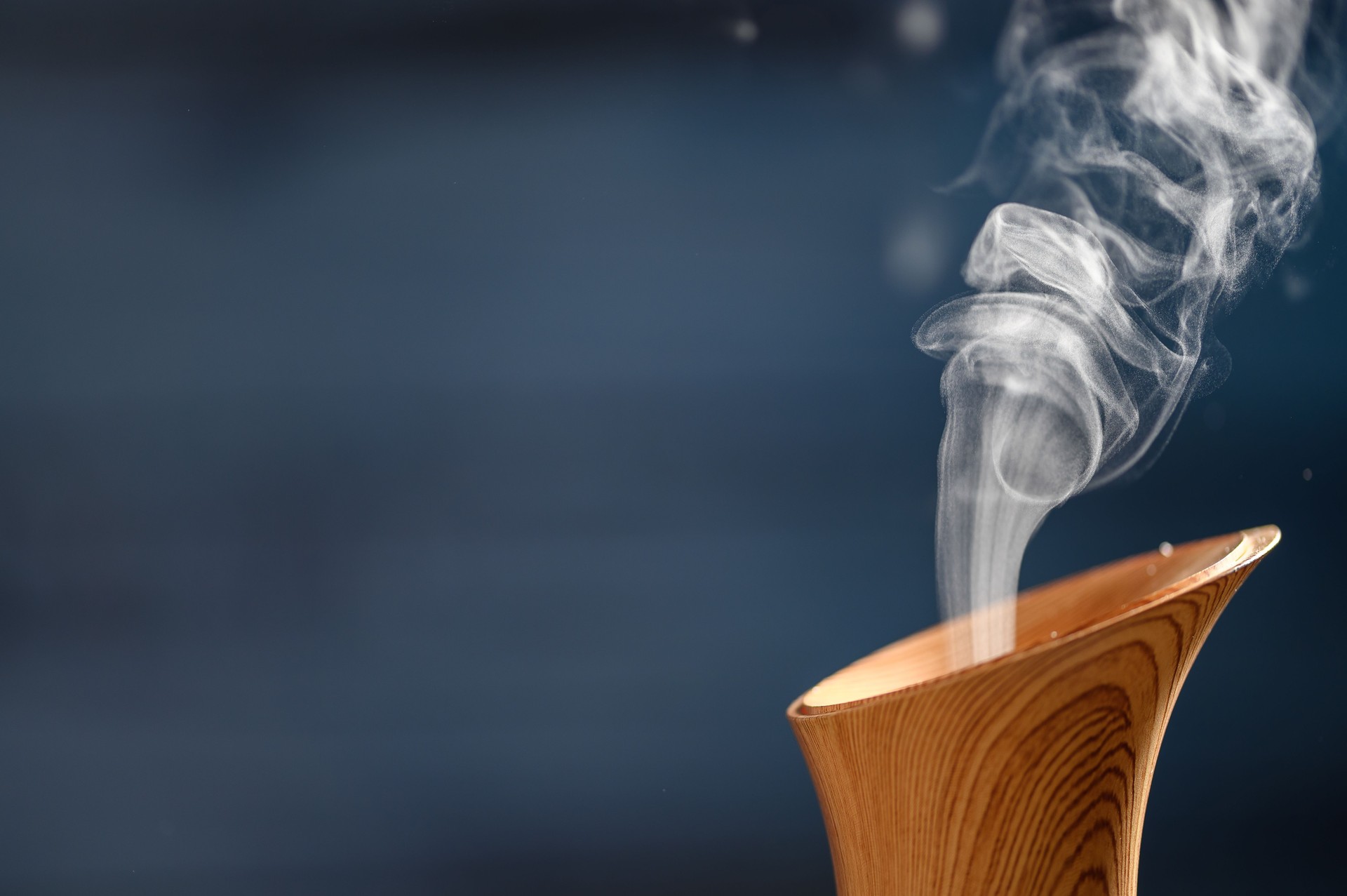 A delicate mist of fragrance rising from an ultrasonic aroma diffuser, aromatherapy
